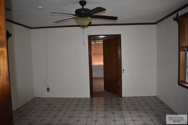 empty room with crown molding and ceiling fan