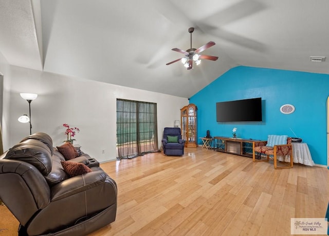 living room with vaulted ceiling, visible vents, ceiling fan, and wood finished floors