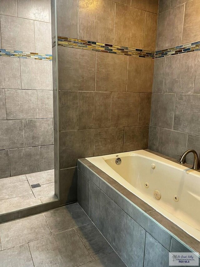 tiled dining space featuring ceiling fan and french doors