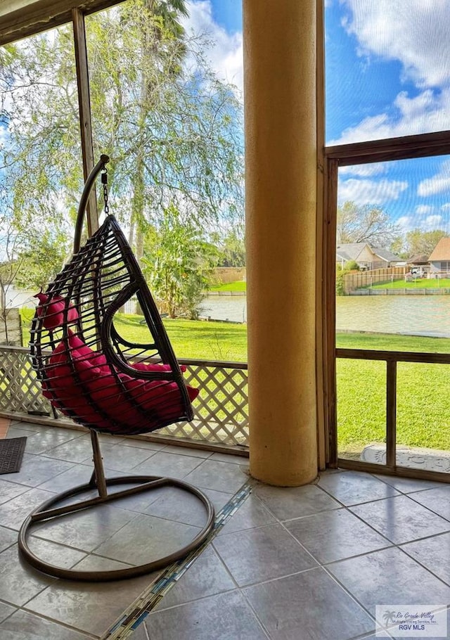 entryway featuring a water view and a wealth of natural light