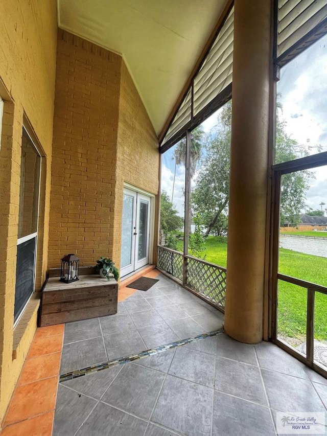 unfurnished sunroom with a fireplace