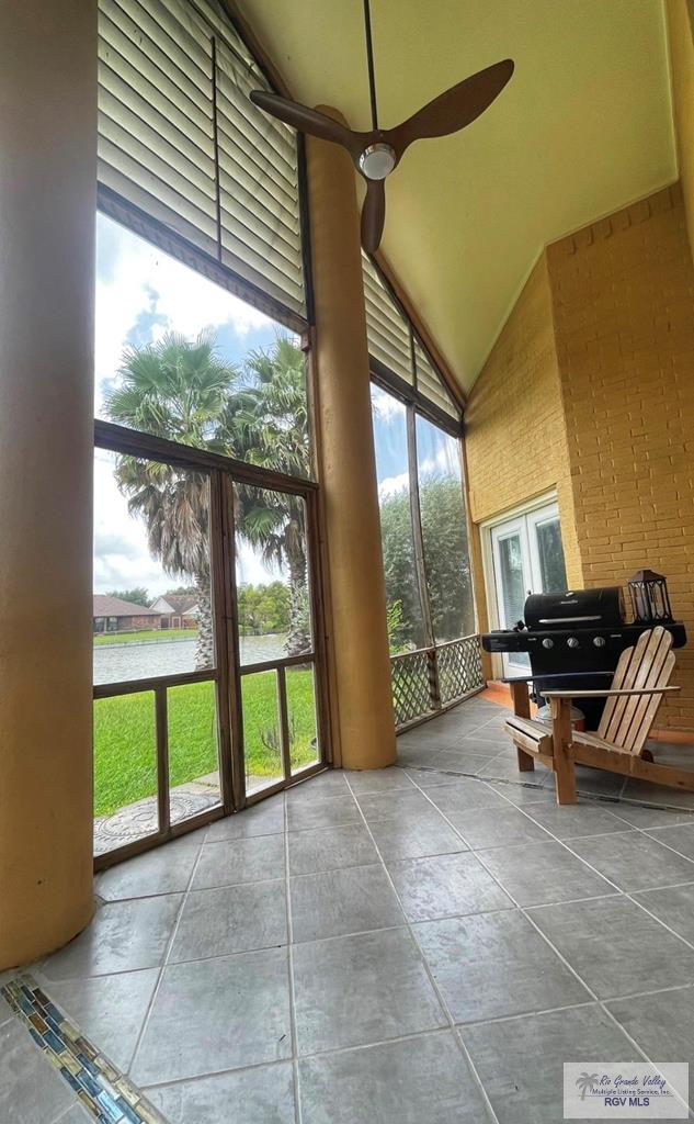 sunroom with ceiling fan and a healthy amount of sunlight