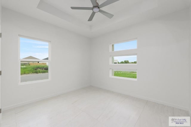 8879 Wentz Lk, Brownsville, TX 78520 - empty room with ceiling fan and a raised ceiling
