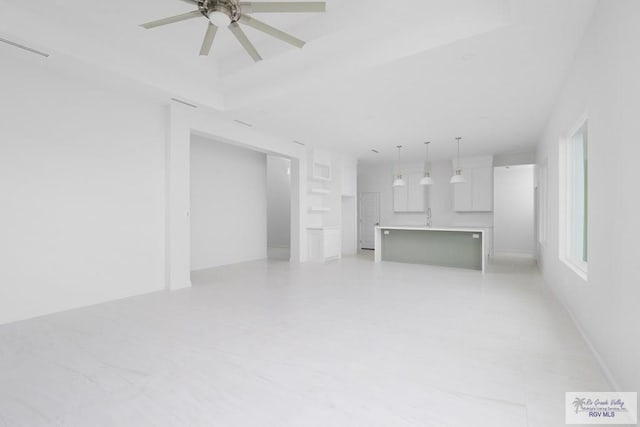 8879 Wentz Lk, Brownsville, TX 78520 - unfurnished living room featuring a sink and a ceiling fan