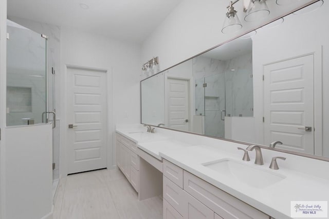8879 Wentz Lk, Brownsville, TX 78520 - bathroom featuring double vanity and a marble finish shower