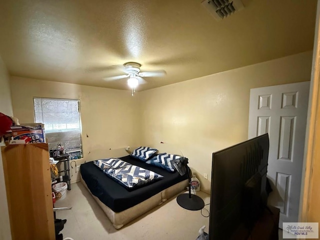 bedroom with a ceiling fan and visible vents