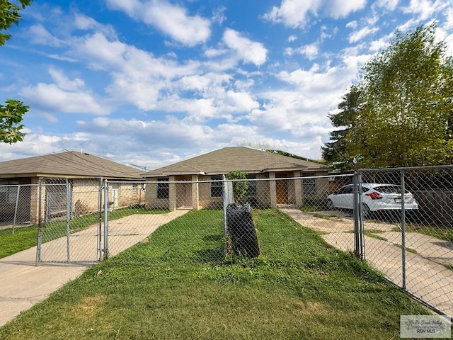 view of front of home featuring a gate, fence, and a front yard
