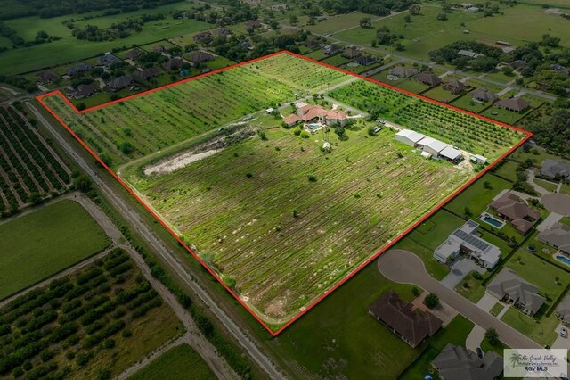 birds eye view of property with a rural view