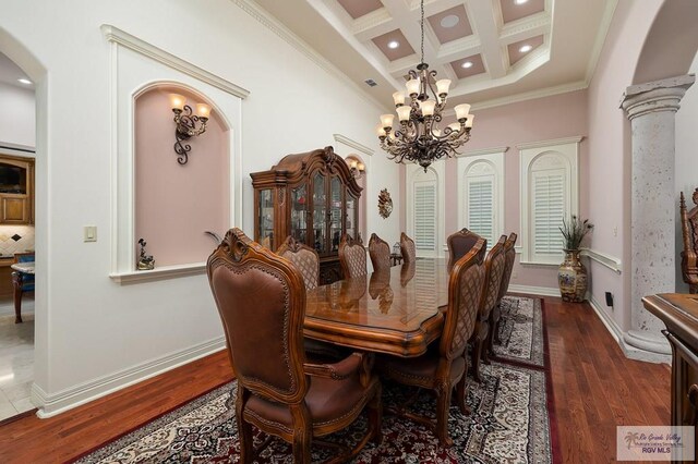 dining space featuring beam ceiling, ornate columns, dark wood-type flooring, coffered ceiling, and crown molding