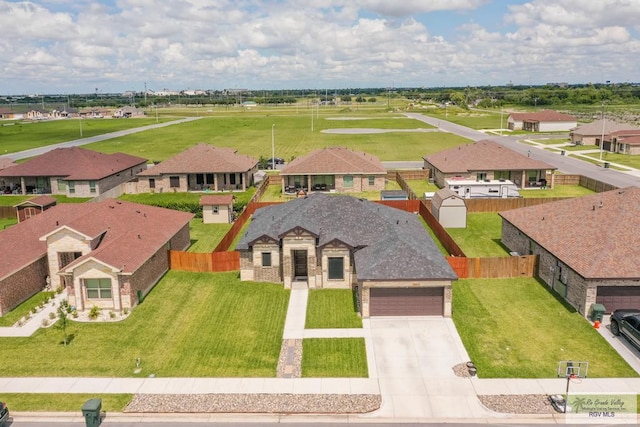 view of front facade with a garage and a front lawn