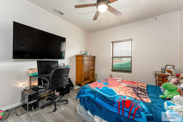 bedroom featuring light wood-type flooring and ceiling fan