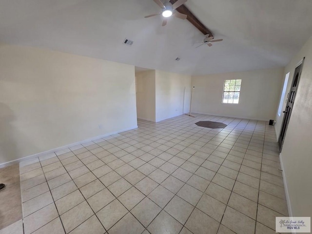 empty room featuring visible vents, baseboards, a ceiling fan, vaulted ceiling with beams, and light tile patterned flooring