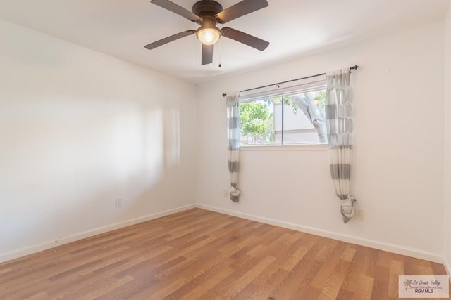 spare room with ceiling fan and hardwood / wood-style floors