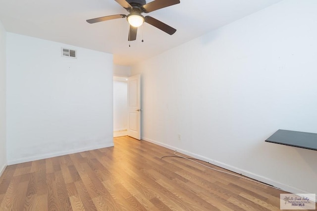 unfurnished room featuring ceiling fan and light hardwood / wood-style flooring