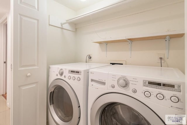 clothes washing area featuring independent washer and dryer