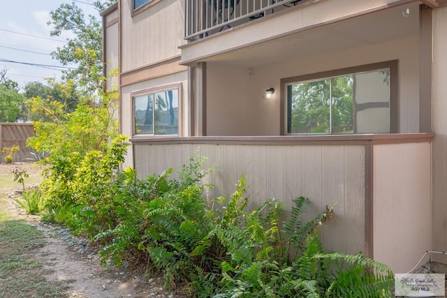 view of side of property featuring a balcony