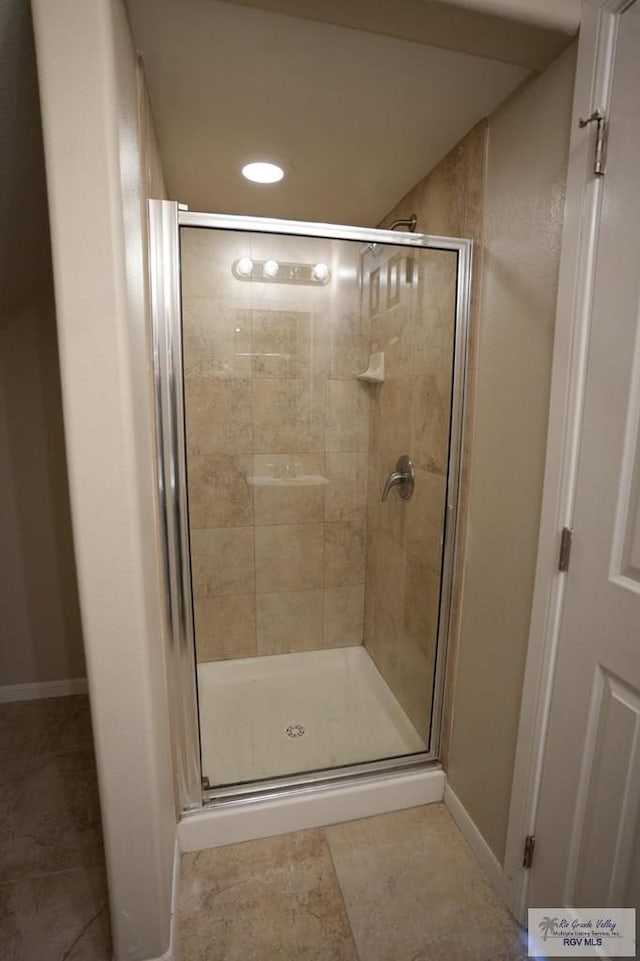 bathroom featuring an enclosed shower