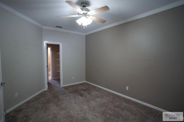 empty room with crown molding, ceiling fan, and dark colored carpet