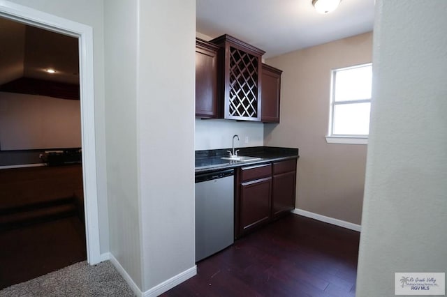 kitchen with dishwasher, dark hardwood / wood-style floors, dark brown cabinetry, and sink