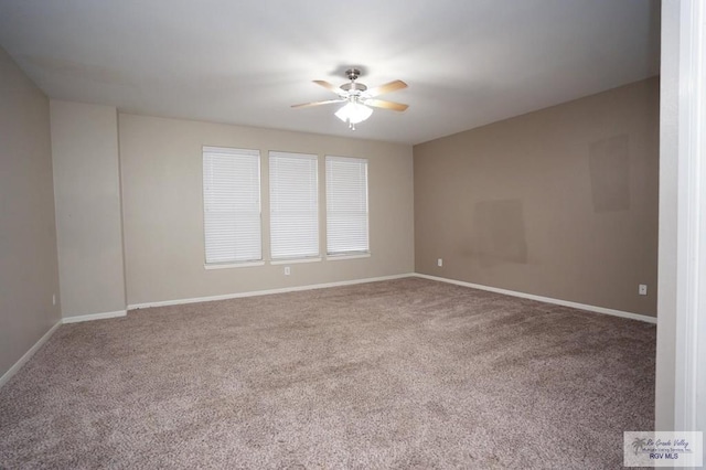 unfurnished room featuring ceiling fan and carpet floors