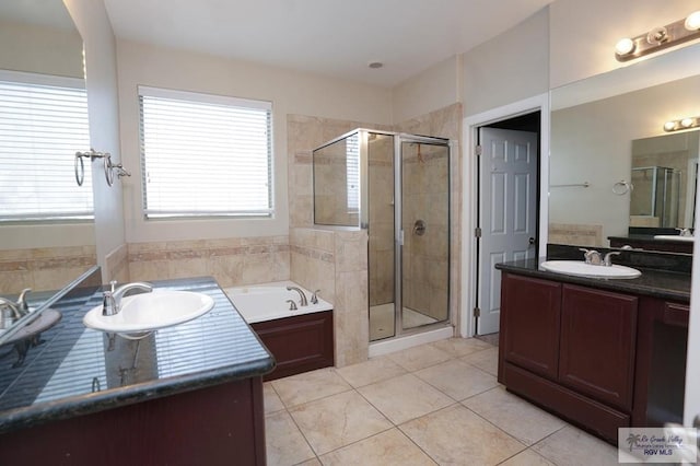 bathroom featuring tile patterned floors, vanity, and plus walk in shower