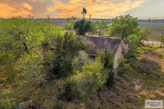 aerial view at dusk with a rural view