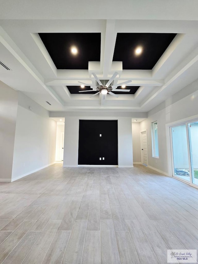 105 Republic Cir, San Benito, TX 78586 - unfurnished living room featuring a ceiling fan, coffered ceiling, light wood-style floors, baseboards, and beam ceiling