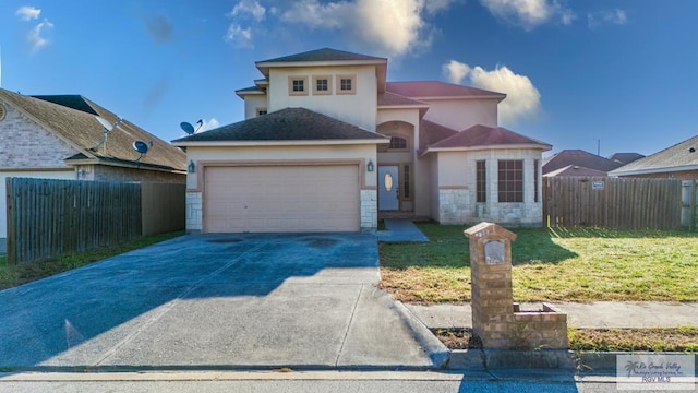 6724 Pino Verde Dr, Brownsville, TX 78526 - mediterranean / spanish-style house with concrete driveway, fence, an attached garage, a front yard, and stucco siding