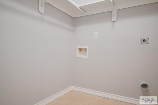 6724 Pino Verde Dr, Brownsville, TX 78526 - clothes washing area with hookup for an electric dryer, light tile patterned flooring, baseboards, laundry area, and washer hookup