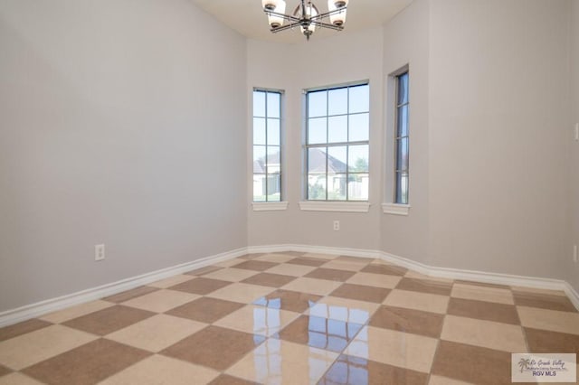 6724 Pino Verde Dr, Brownsville, TX 78526 - empty room with a chandelier and baseboards