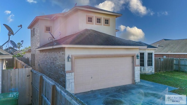 6724 Pino Verde Dr, Brownsville, TX 78526 - exterior space with a shingled roof, a fenced backyard, stucco siding, brick siding, and a garage