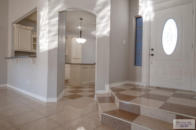 6724 Pino Verde Dr, Brownsville, TX 78526 - entrance foyer with baseboards and light tile patterned floors