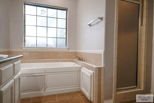6724 Pino Verde Dr, Brownsville, TX 78526 - bathroom featuring a garden tub, tile patterned flooring, and a stall shower