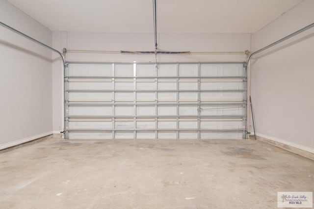 6724 Pino Verde Dr, Brownsville, TX 78526 - garage featuring baseboards