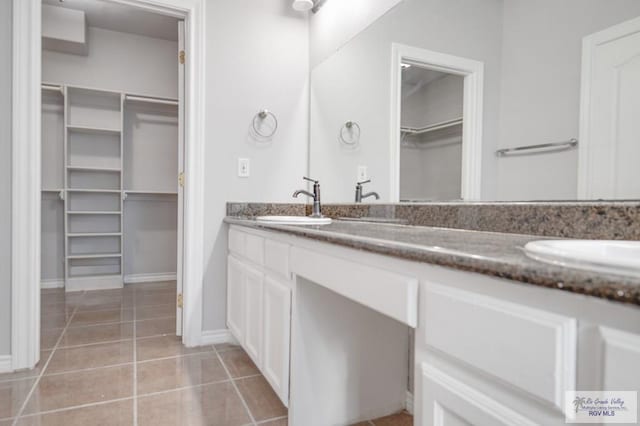 bathroom featuring tile patterned floors and vanity