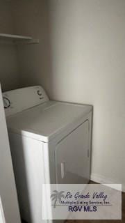 washroom with laundry area and washer / clothes dryer
