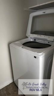 laundry area featuring laundry area and baseboards