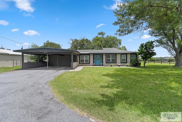 ranch-style home with a front yard