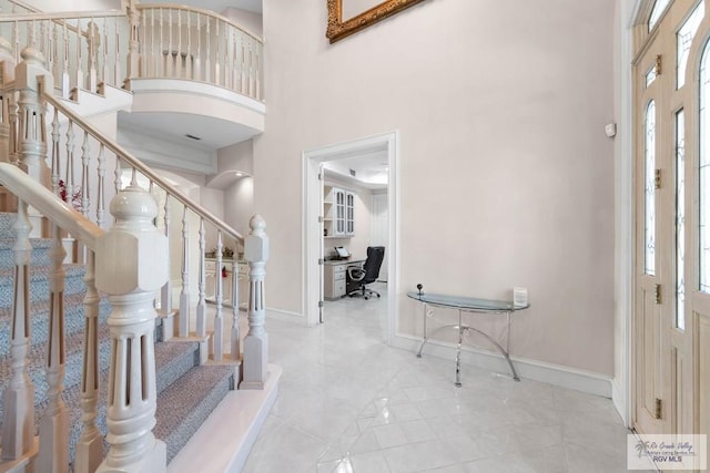 foyer entrance with a high ceiling