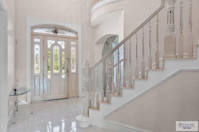 entryway with a high ceiling