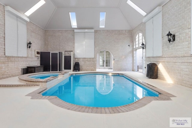 view of pool with a skylight