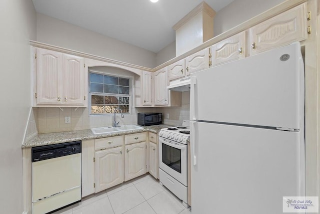 kitchen with white appliances, sink, decorative backsplash, light tile patterned floors, and custom range hood