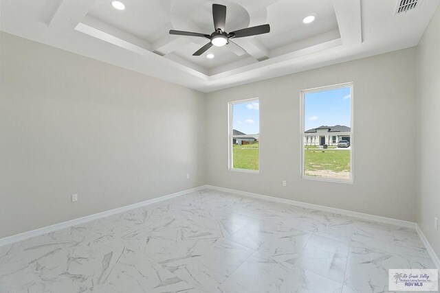 446 Parker Rd, La Feria, TX 78559 - spare room with a ceiling fan, coffered ceiling, recessed lighting, baseboards, and light marble finish floors