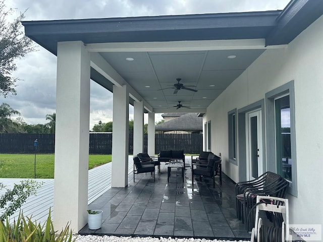 view of patio / terrace with ceiling fan and an outdoor hangout area