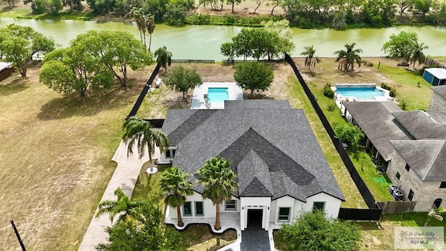 birds eye view of property featuring a water view