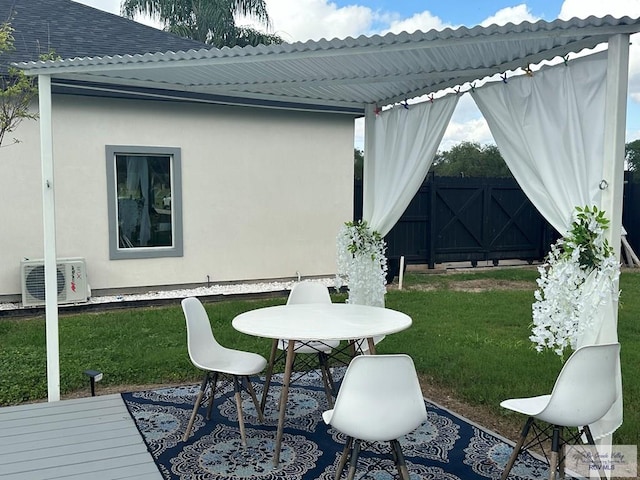 exterior space featuring ac unit and a yard