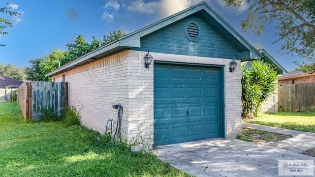 garage with a lawn