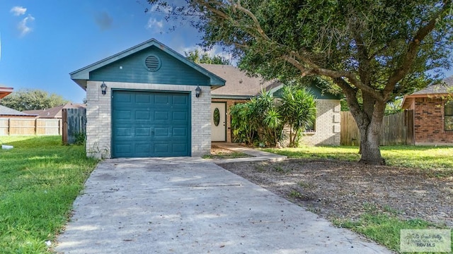 view of front facade with a front yard and a garage