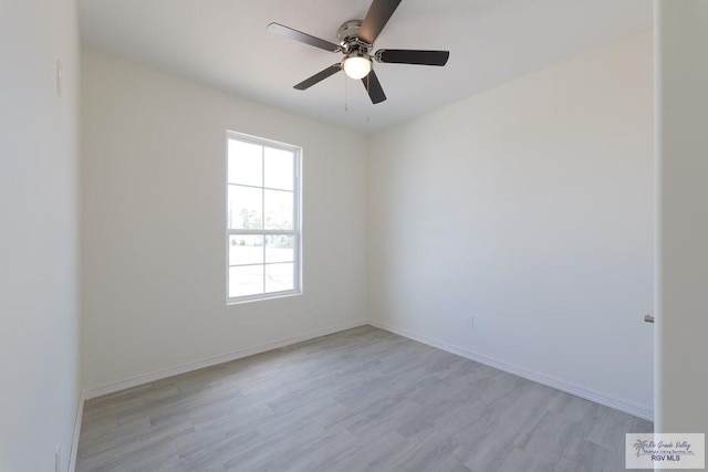 spare room with ceiling fan and light hardwood / wood-style floors