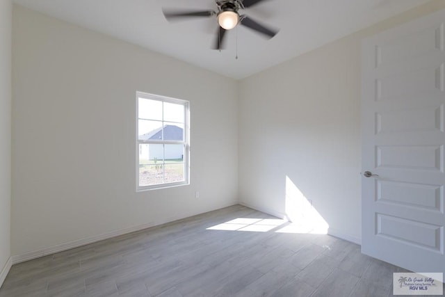 spare room with ceiling fan and light hardwood / wood-style floors